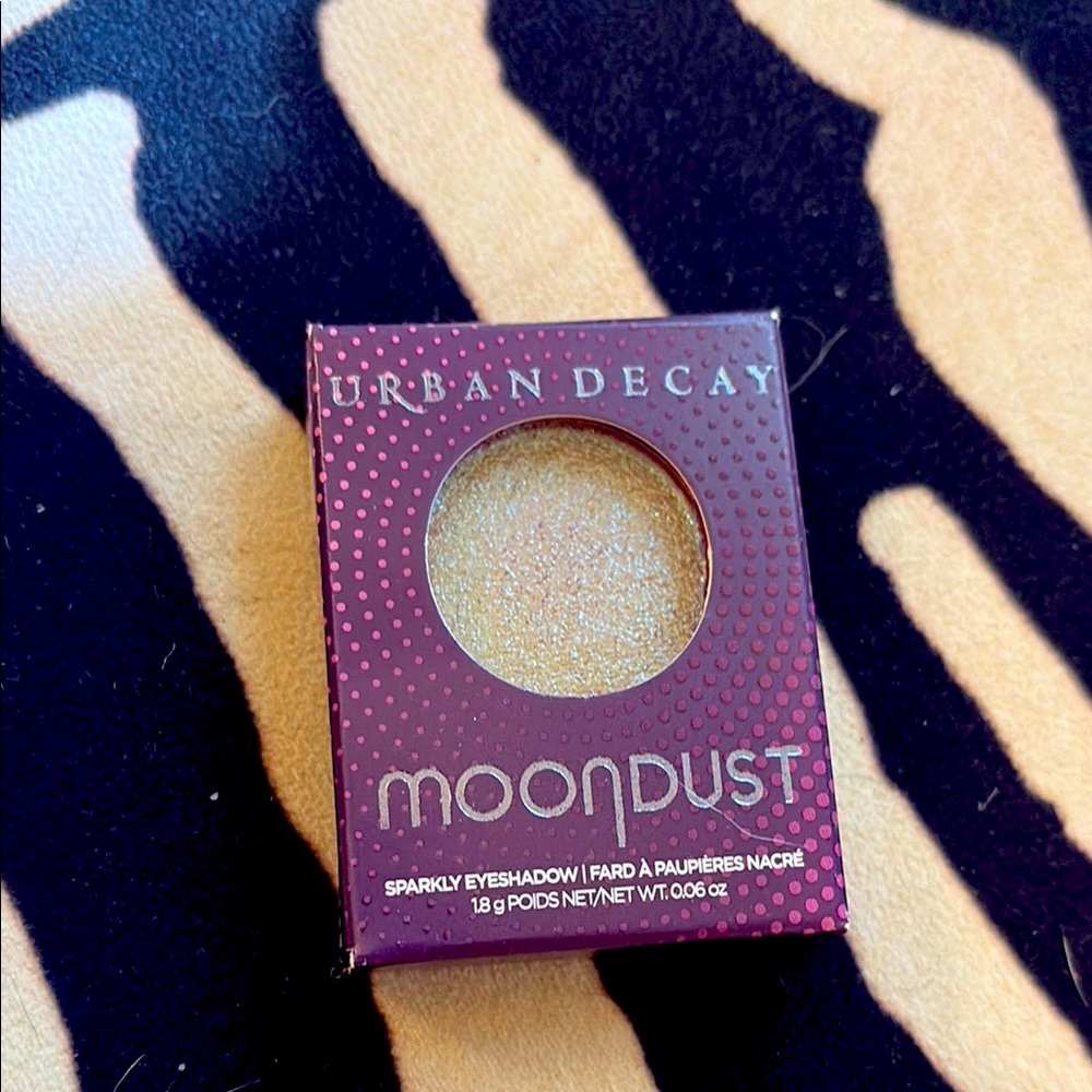Urban Decay Moondust Eyeshadow in Shimmering gold/green/blue sparkle topper. New
